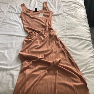 Maxi dress with slit on left back.